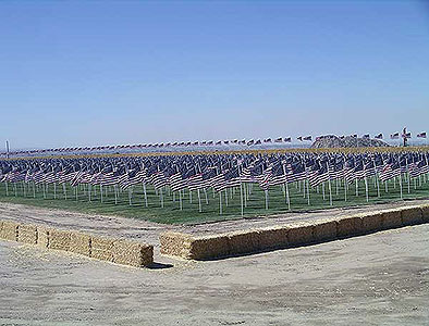 Patriot Day Healing Field at Crossroads Point memorial display bordered by straw bales